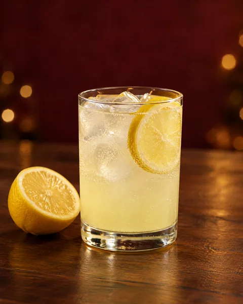 Simple sparkling lemonade with ice and a lemon wheel